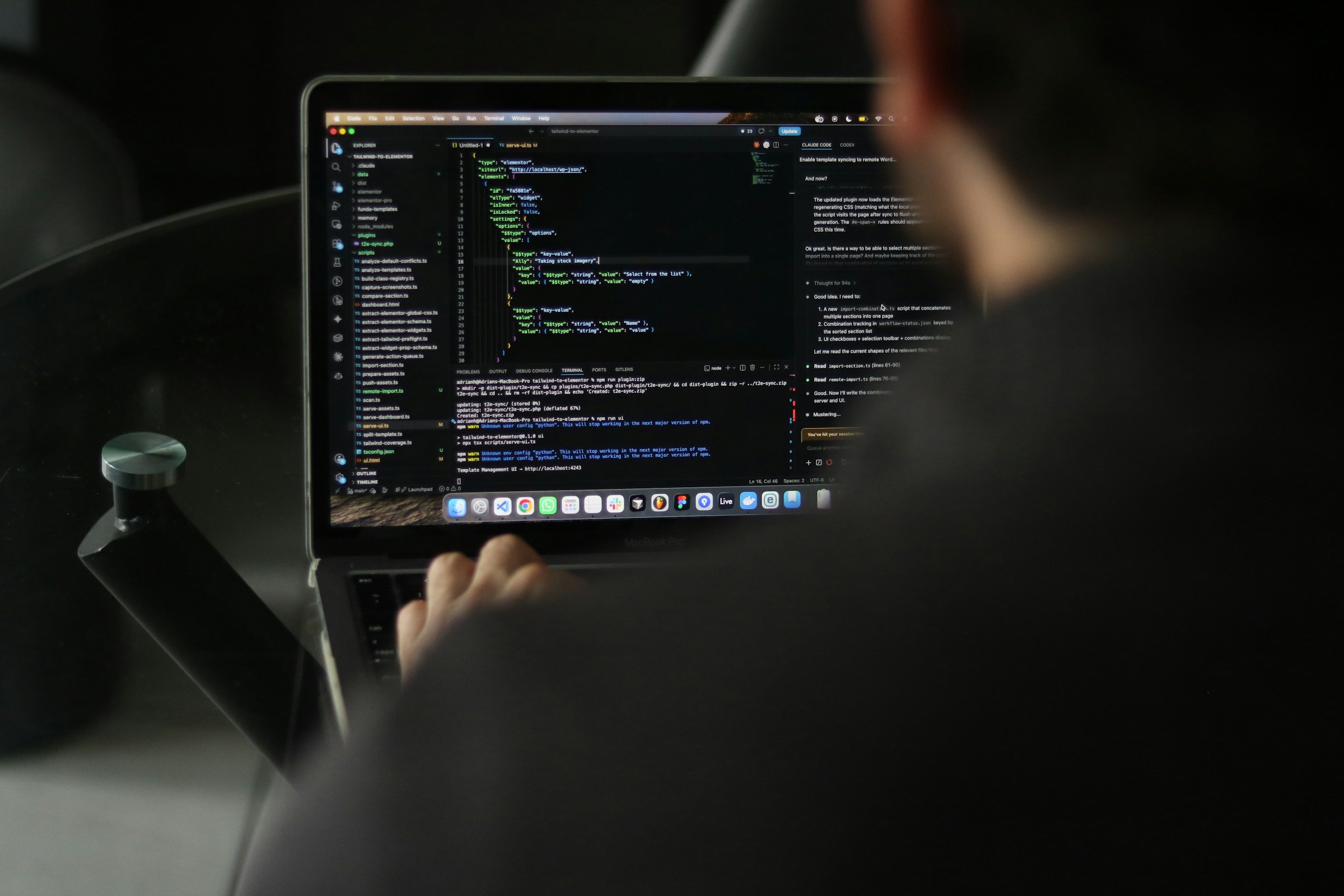 A person working with code on a laptop